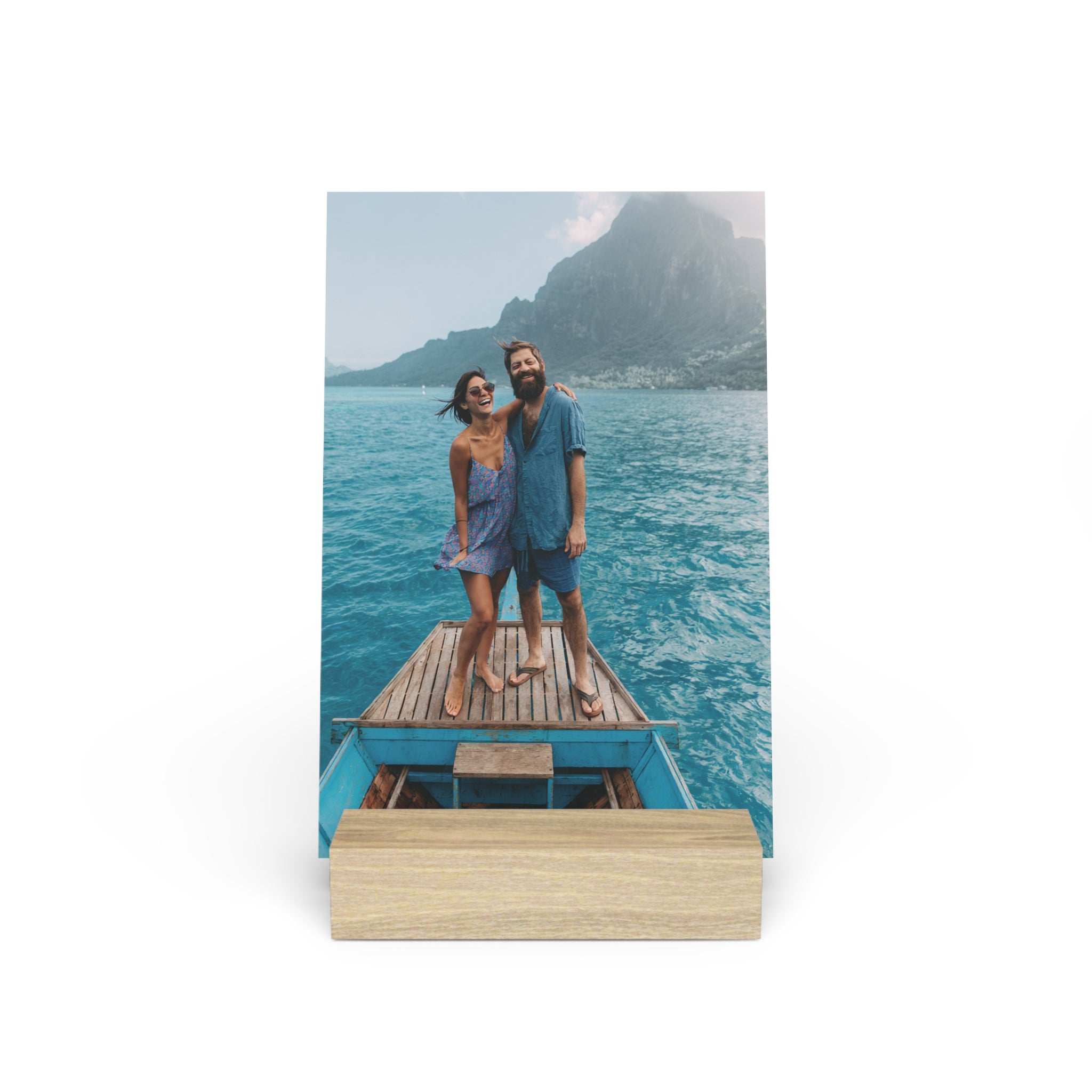 Personalized couple photo stand with photo of couple on a boat near tropical mountains