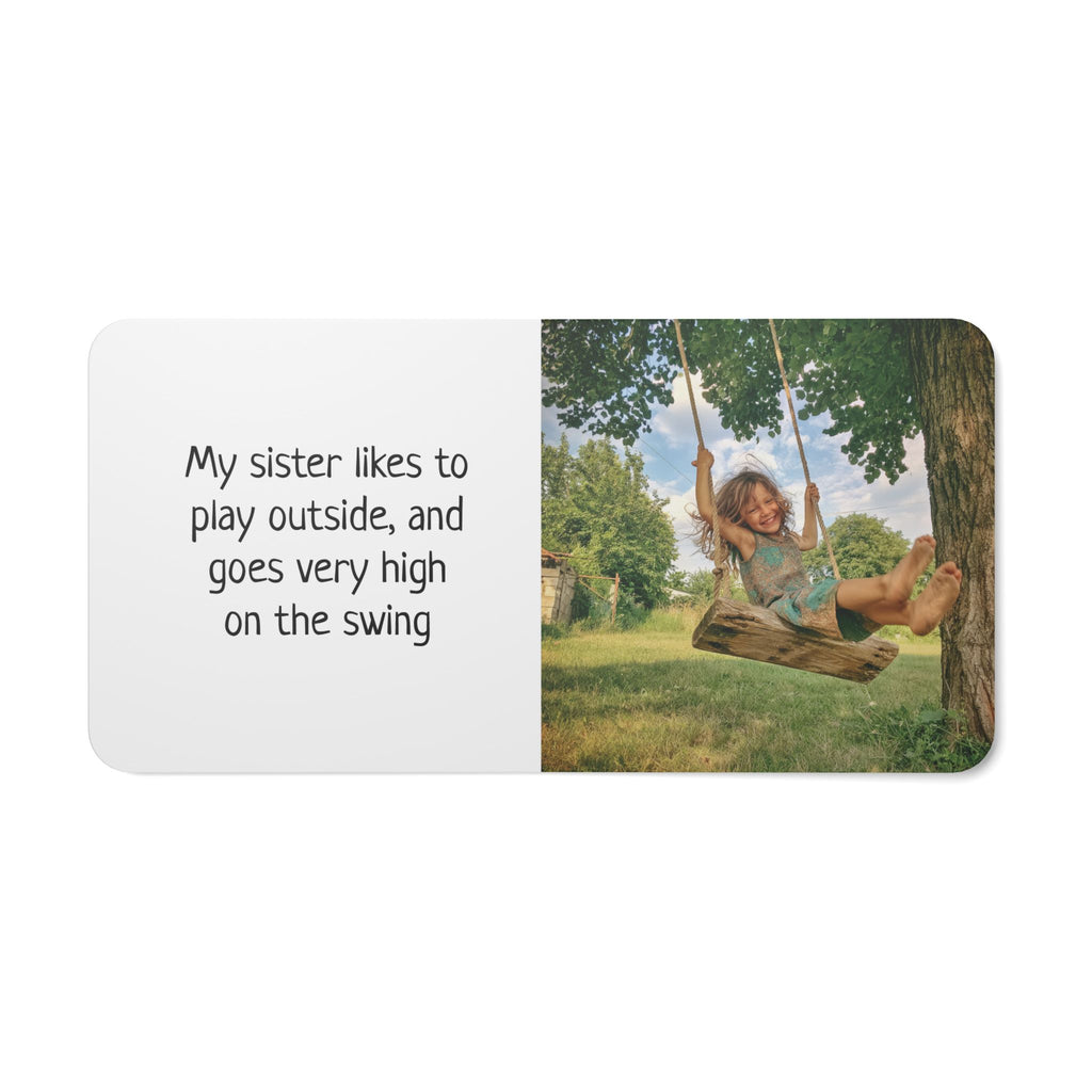 Personalized family board book stacked with other keepsakes