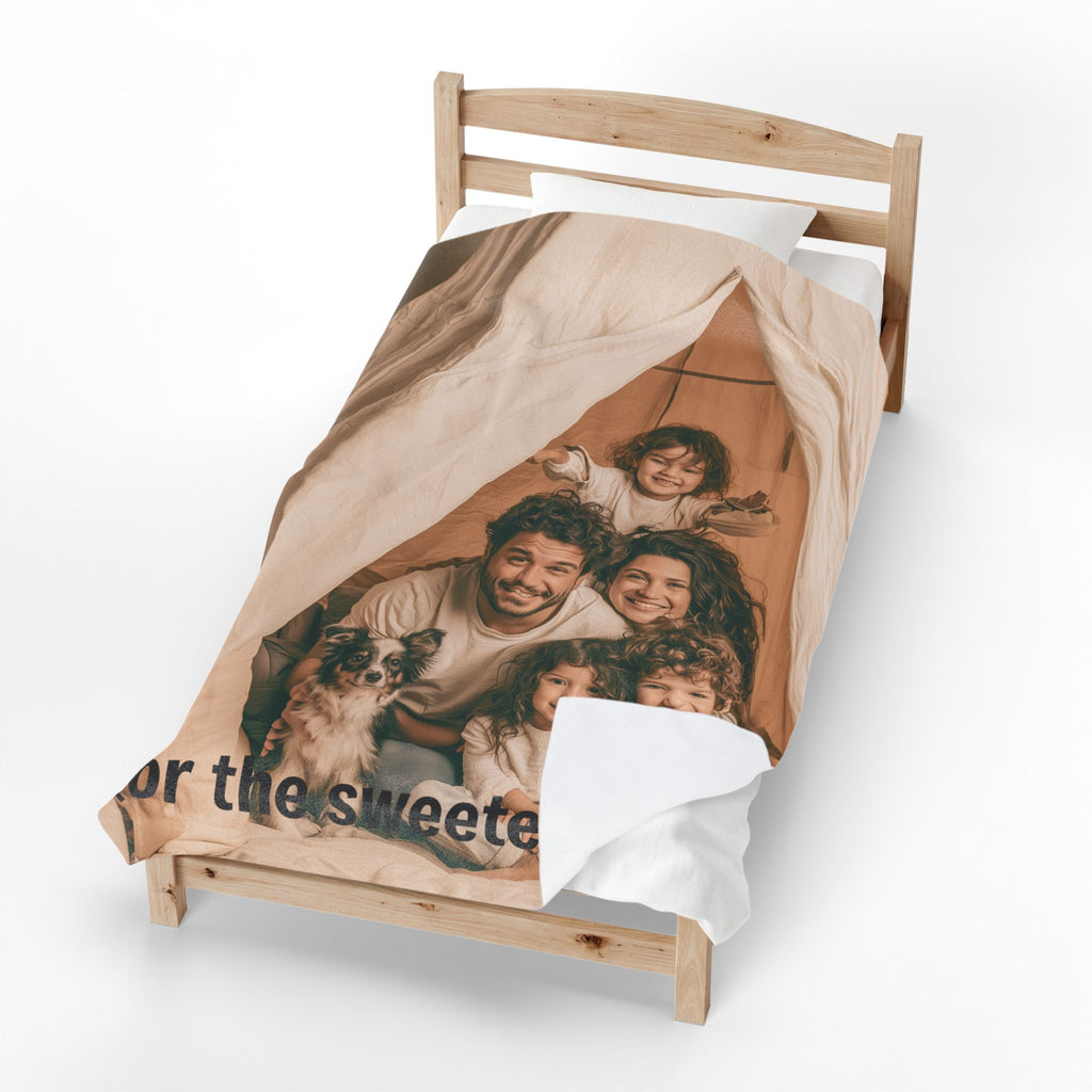 Personalized mom photo blanket folded on a bed