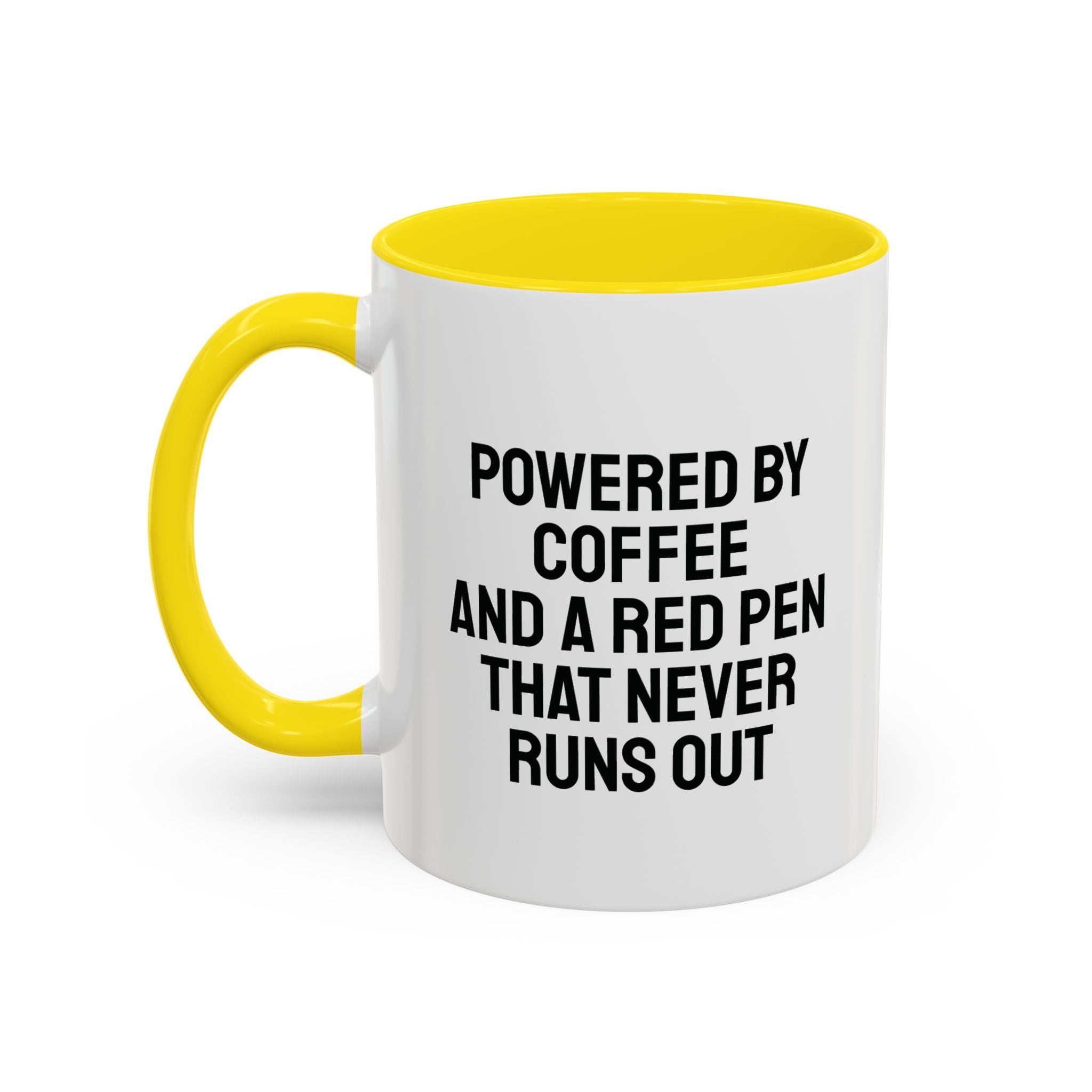 Personalized teacher mug next to graded papers with red pen